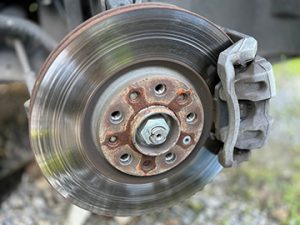 GroovedAndWarpedRotorOnAVehicle - Meineke New Hampshire Meineke Car Care | Brake Rotors | Merrimack NH